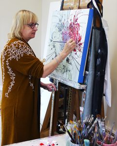 artist with painting