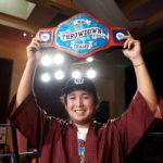 Brian Tan with championship belt