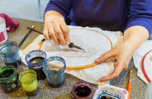 Artist working on a Batik Silk Painting