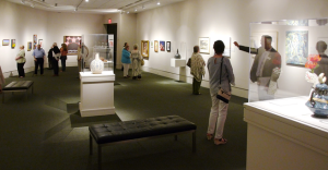 Guests viewing art installation at mobile museum of art