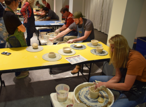 Students working on pottery