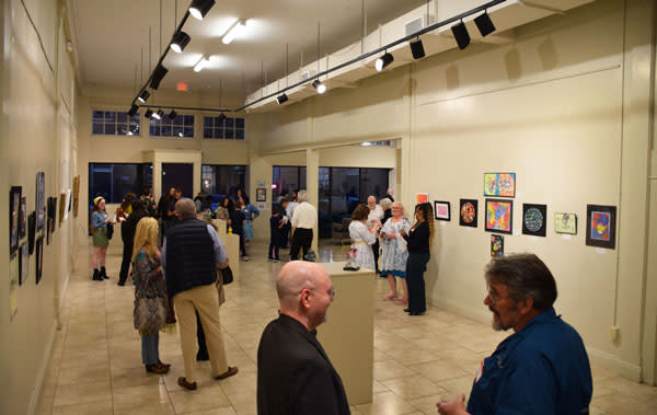 Guests socializing at Mobile Arts Council’s Gallery @ Room 1927