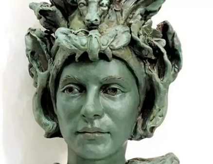 Emerald clay head sculpture with dragon headdress