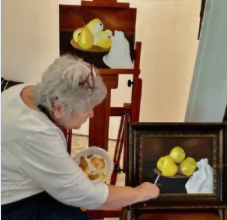 Artist Patty White painting bowl of pears