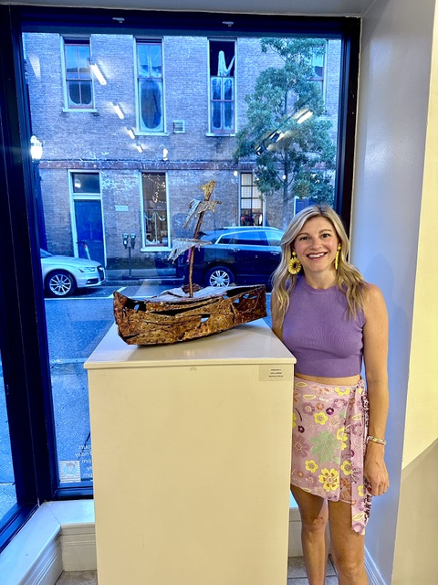 Laura Ledbetter seen with ship sculpture in Mobile Arts Council Gallery