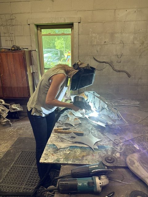 Laura Ledbetter welding in studio 