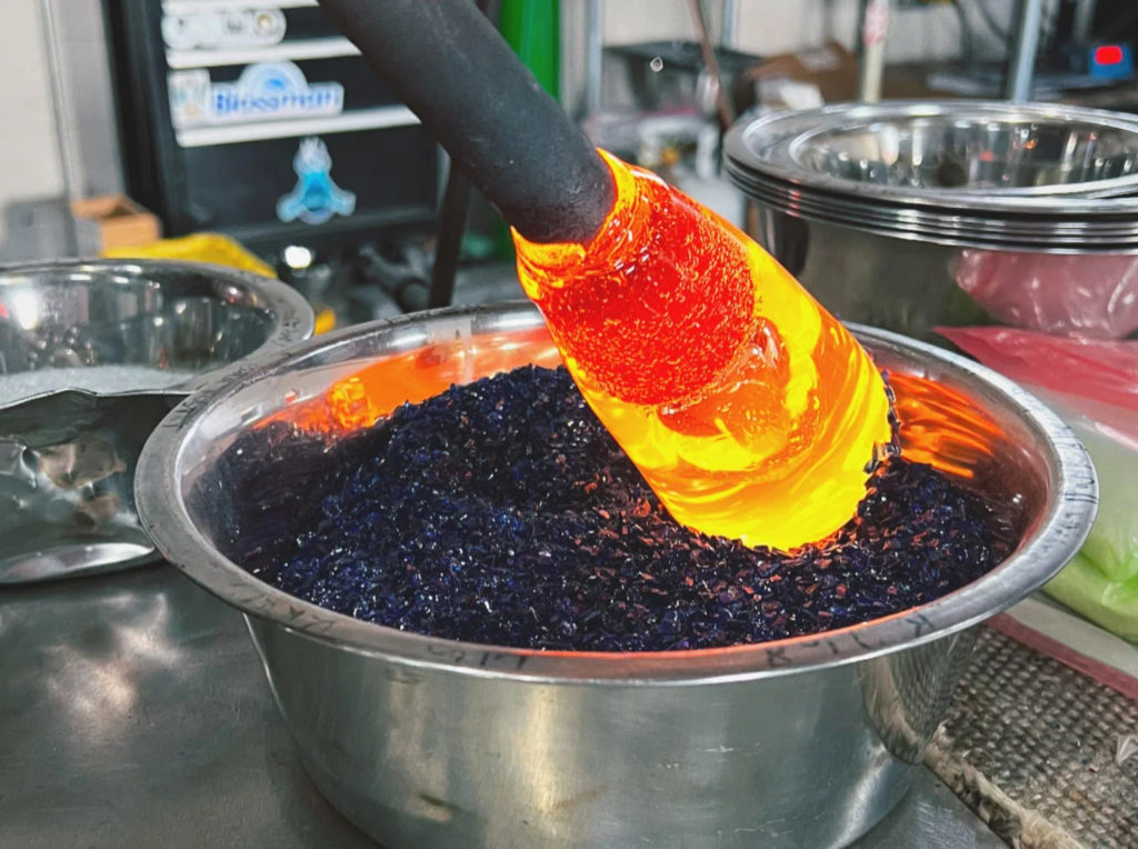 Hot Glass rod dipped in colored glass bits