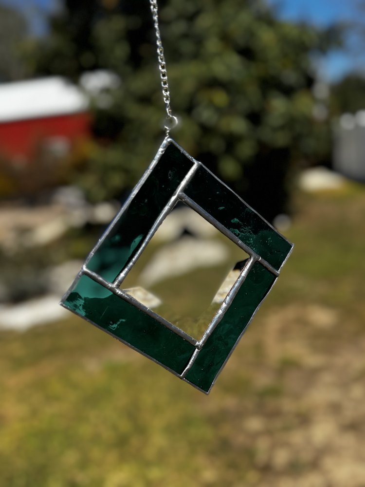 Square, dark green stained glass wall hang