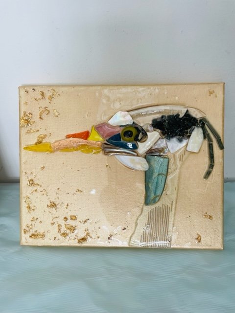 Crushed glass & resin artwork of coastal bird