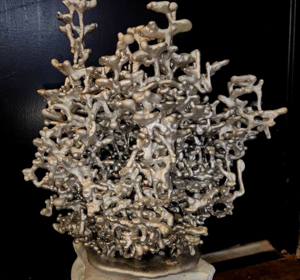 aluminum sculpture of fire ant hill by Cade Thornton