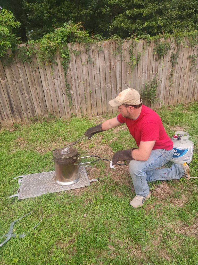 Cade Thornton making aluminum fire ant hill castings