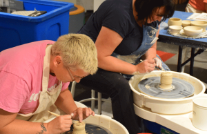 Adults using Pottery Wheel