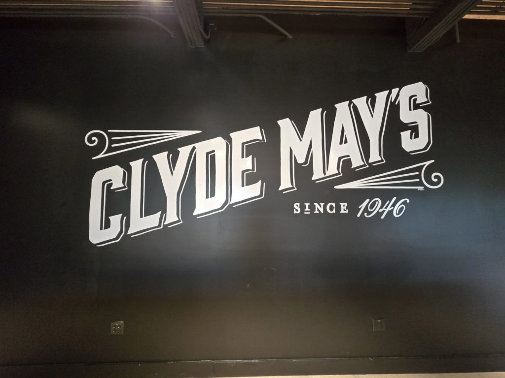 
Clyde May's Hand painted sign by New Hand Signs
