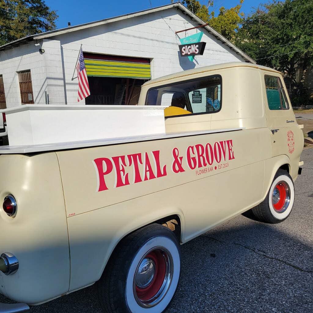 New Hand Signs Petal and Groove painted sign on bus