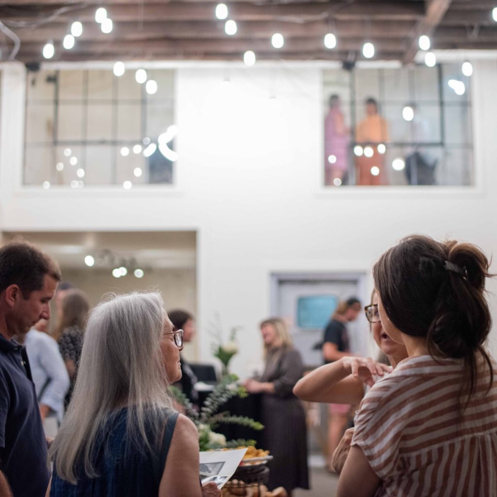Crowd socializing at Alabama Contemporary