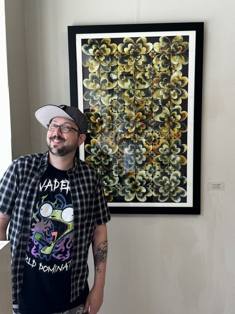Beau Buchanan with his watercolor at Mobile Arts Council Members' Show 2025